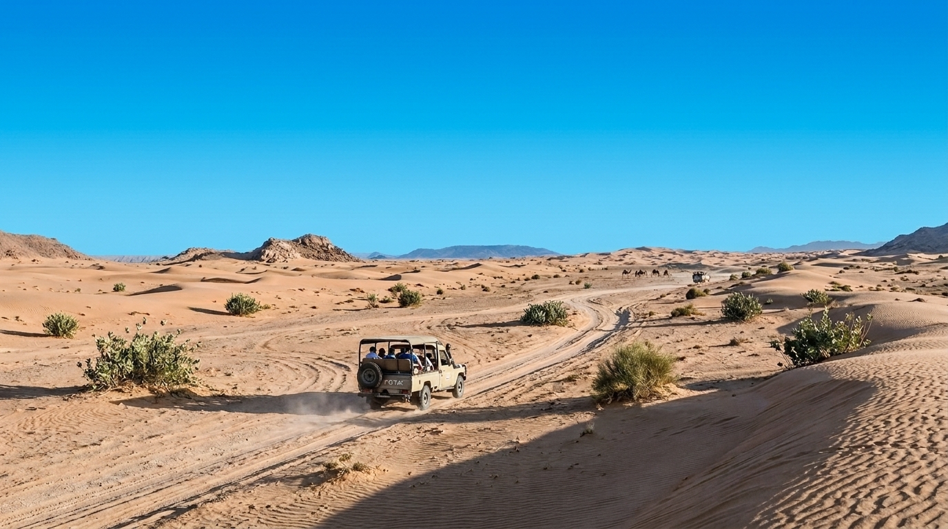2Vegas Desert Adventure Vehicle driving through the Nevada desert dunes